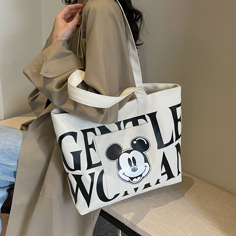 Disney Large Capacity Canvas Bag Women's 2024 New Trendy Cartoon Mickey Tote Bag College Student Class Shoulder Tote Bag. 