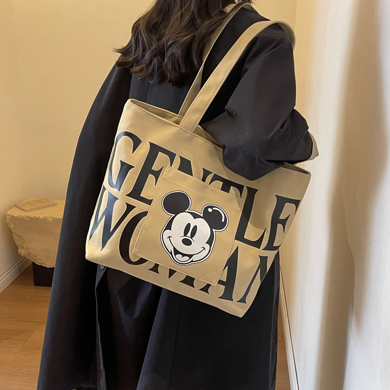 Disney Large Capacity Canvas Bag Women's 2024 New Trendy Cartoon Mickey Tote Bag College Student Class Shoulder Tote Bag. 