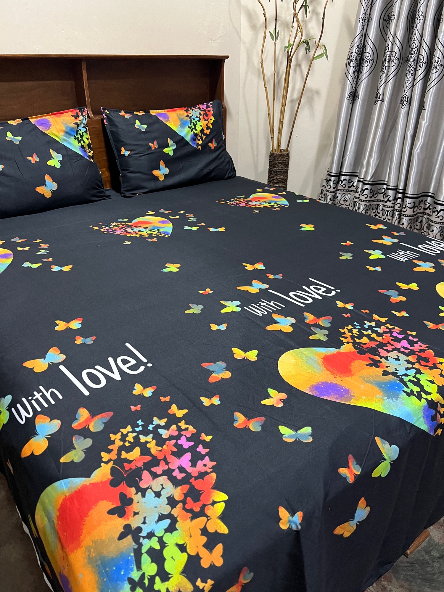 black bed sheet with 2 pillow cases. 