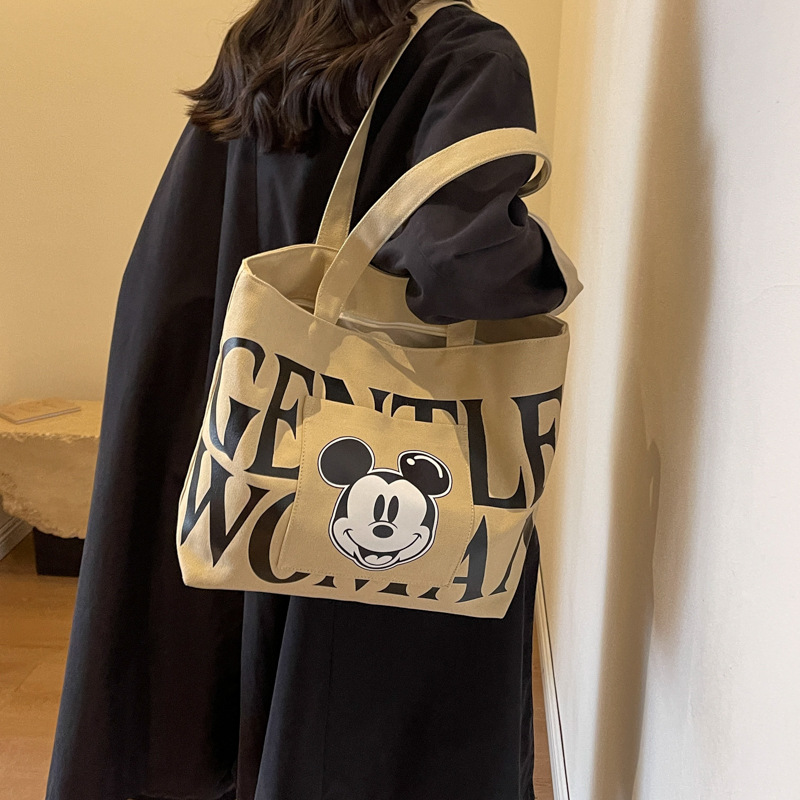 Disney Large Capacity Canvas Bag Women's 2024 New Trendy Cartoon Mickey Tote Bag College Student Class Shoulder Tote Bag. 