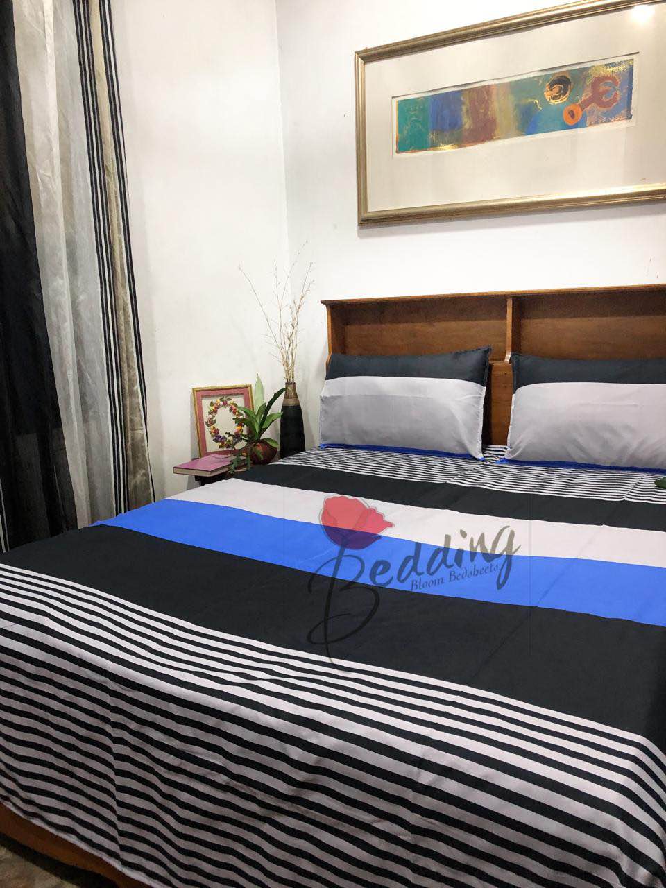 black bed sheet with 2 pillow cases. 